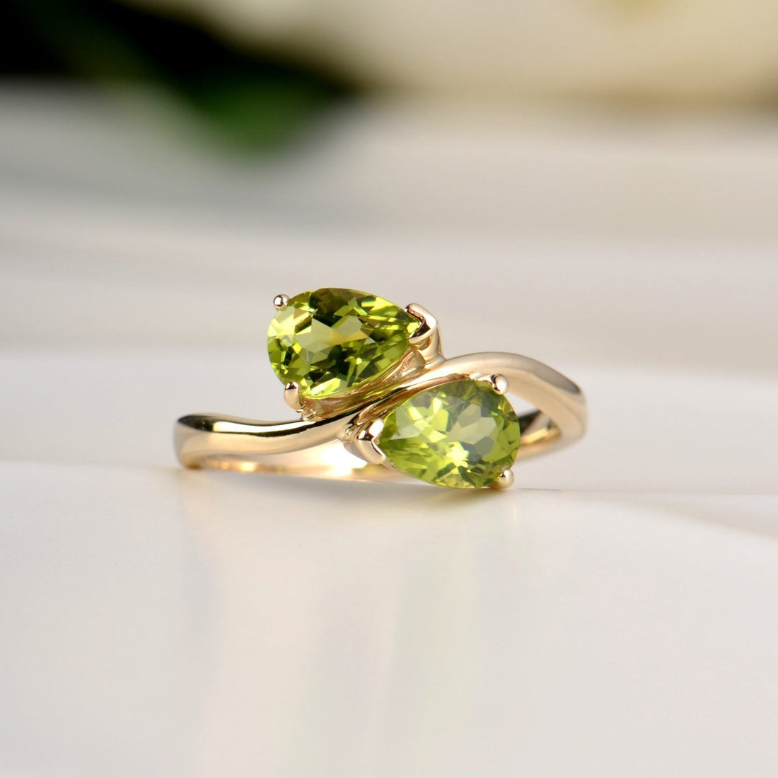 Bespoke two stone twist peridot yellow gold ring from Christine Sadler