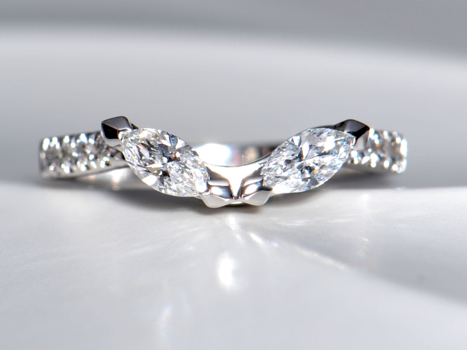 Top-down view of a philosophy ring where two marquise diamonds form the shape of owl eyes, symbolising wisdom - Christine Sadler