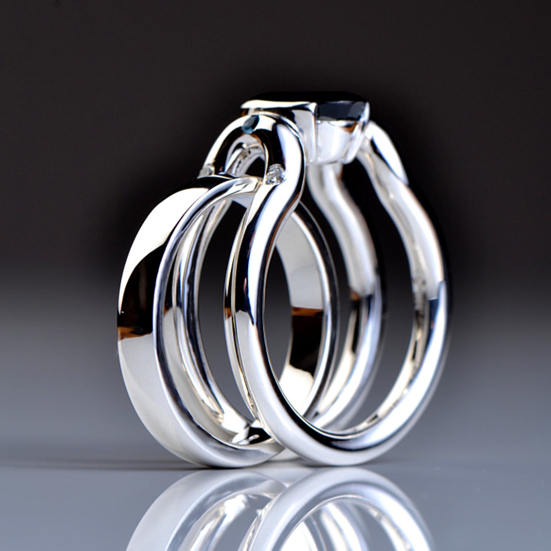 A sapphire engagement ring and wedding ring set.