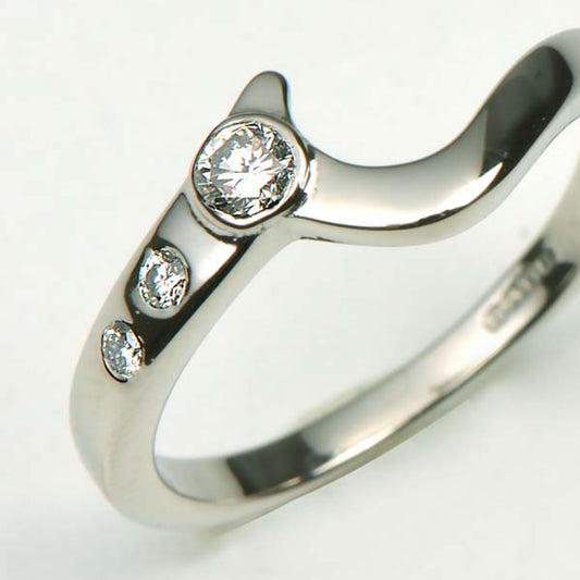 Shaped wedding ring using the customer's diamonds