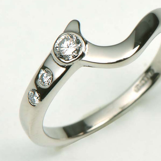 Shaped wedding ring using the customer's diamonds