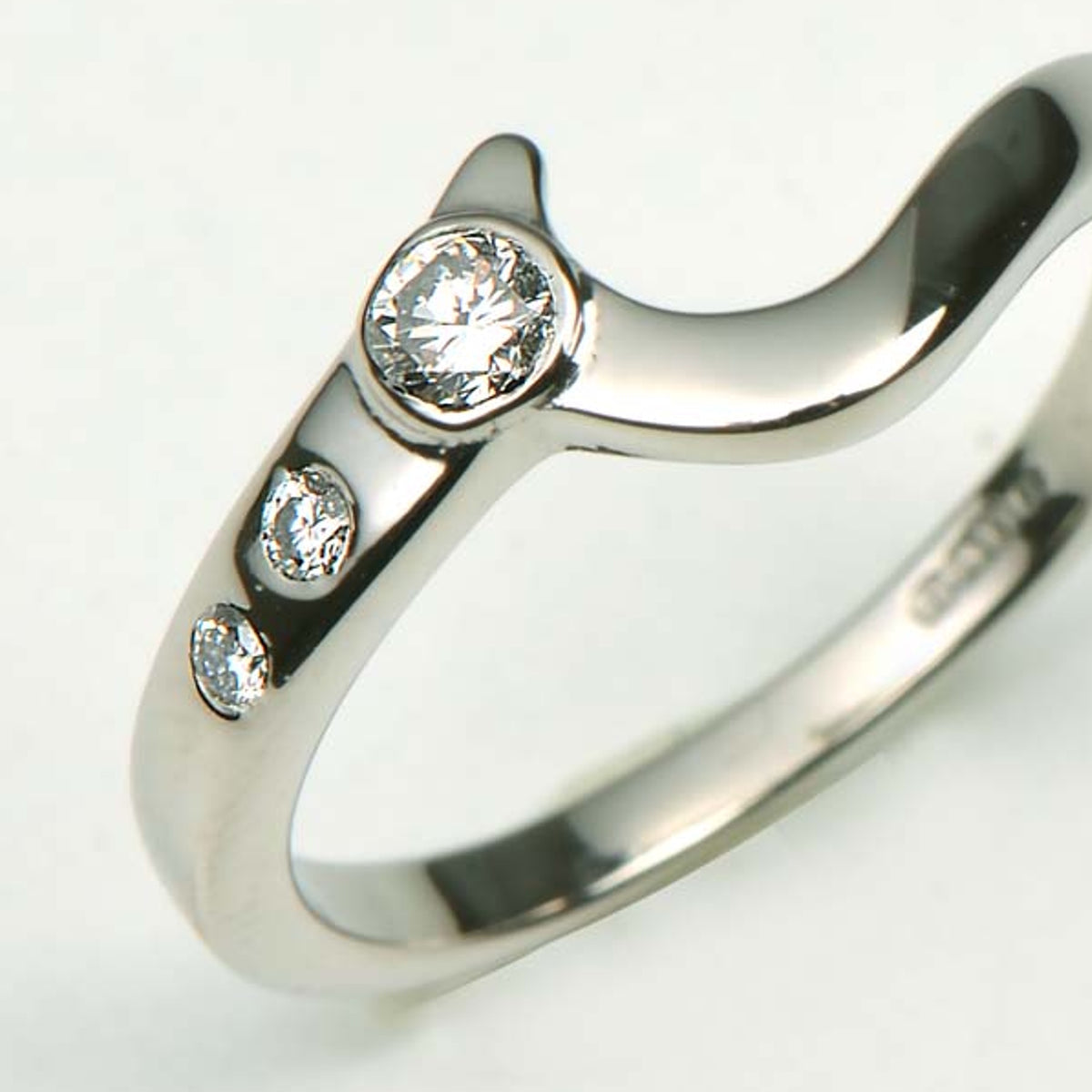 Shaped wedding ring using the customer's diamonds