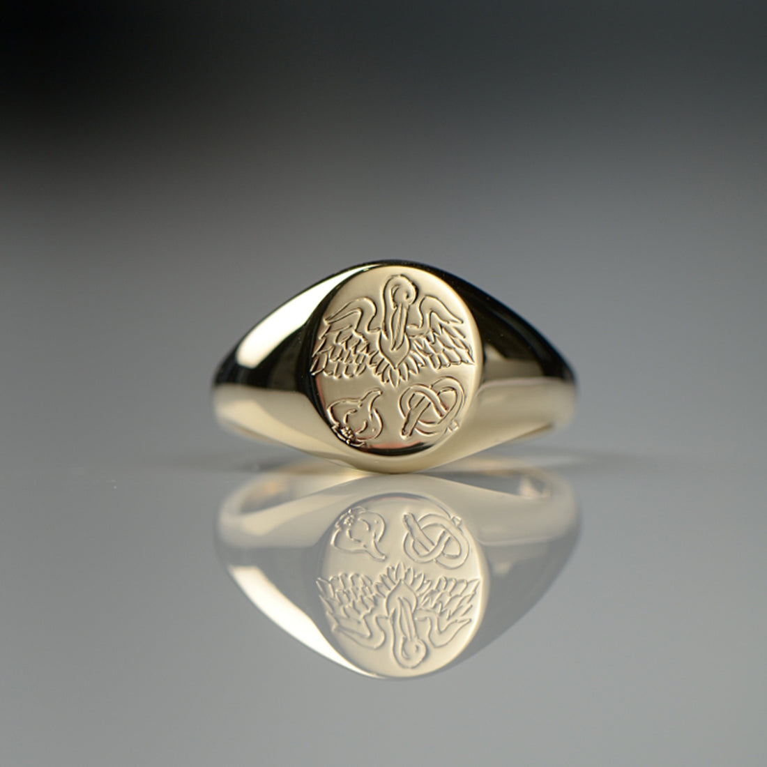 Gold signet ring with a unique family crest