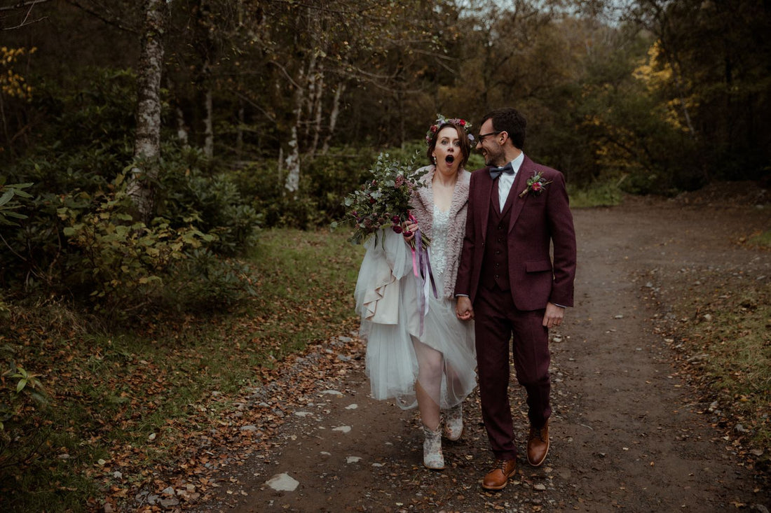a bride and groom in a forest in Scotland, Bride is shocked at her husband's surprise