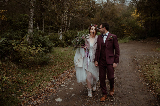 a bride and groom in a forest in Scotland, Bride is shocked at her husband's surprise