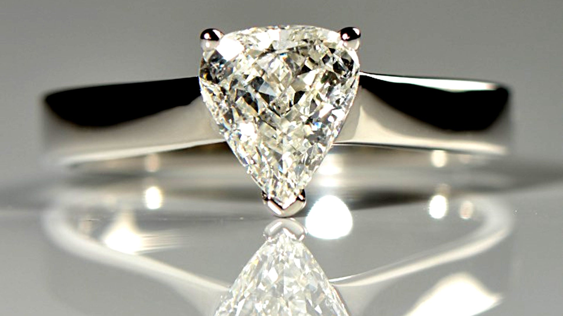 unique platinum engagement ring with a briolette diamond cut into the shape of an arrow head - Christine Sadler