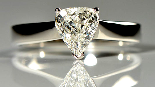 unique platinum engagement ring with a briolette diamond cut into the shape of an arrow head - Christine Sadler