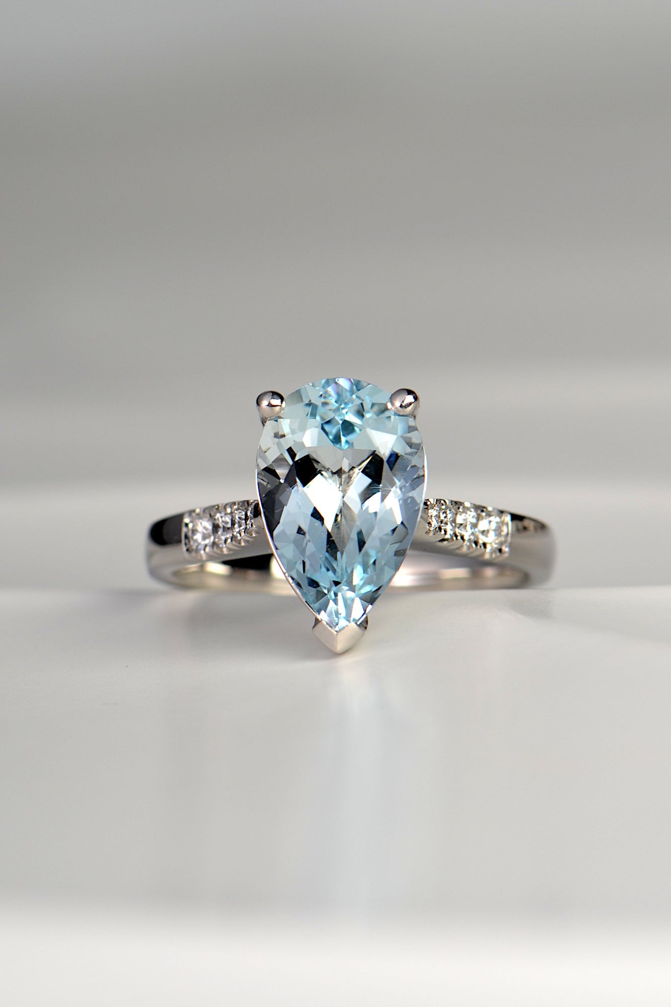 large pear cut aquamarine platinum ring with diamond shoulders - Christine Sadler UK