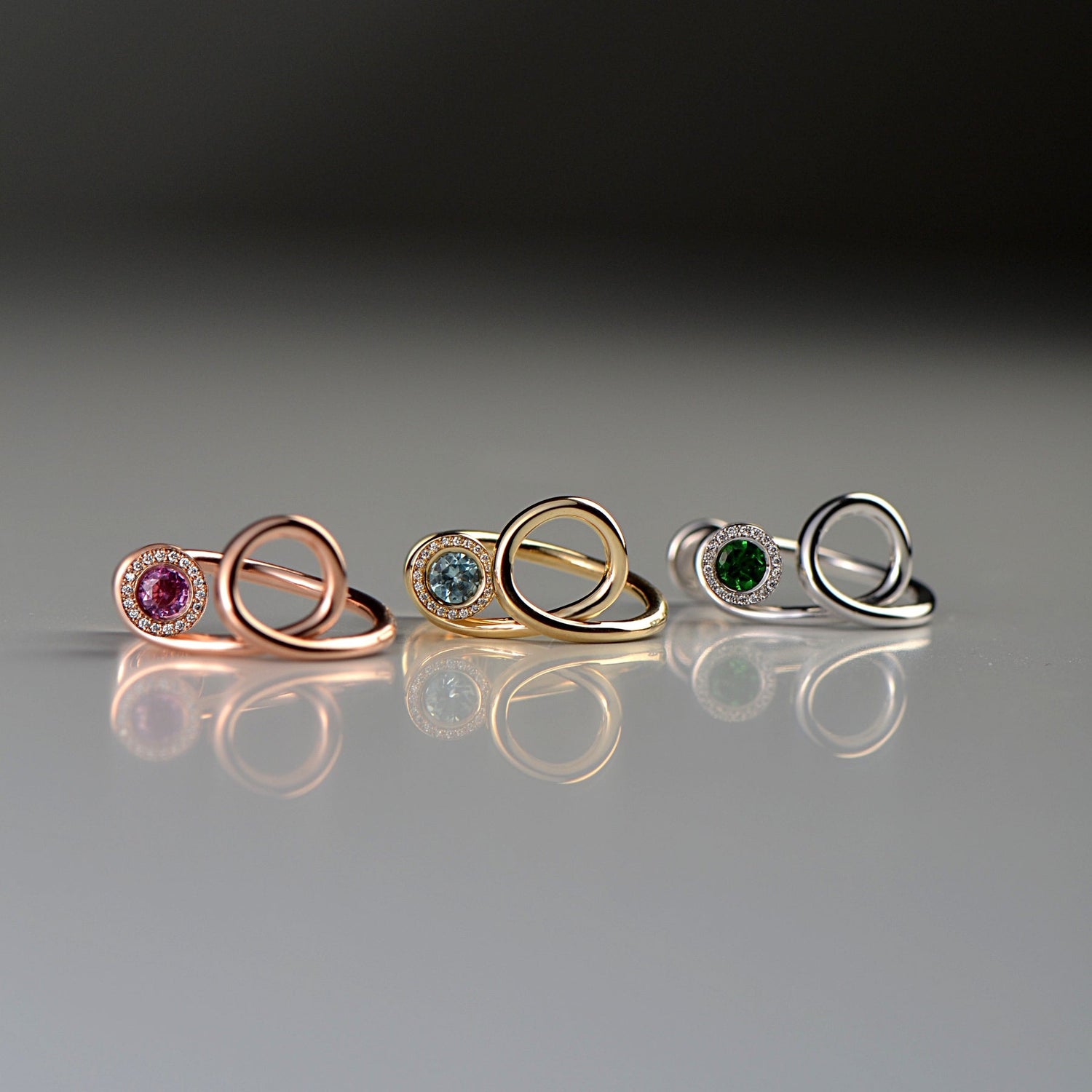 the perfect diamond and gemstone ring for a bartender or mixologist, these cocktail rings have tiny cocktail glasses that can be removed from the ring so the stone can be changed