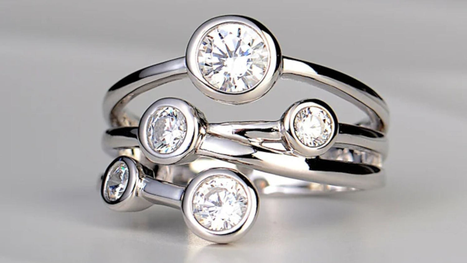 affordable modern five stone bubble ring in silver and cz