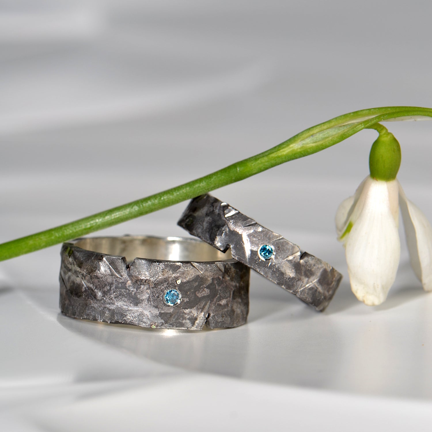 ultra modern black wedding rings set with blue diamonds - ultra modern wedding ring designs for men exclusively available from jewellery designer Christine Sadler