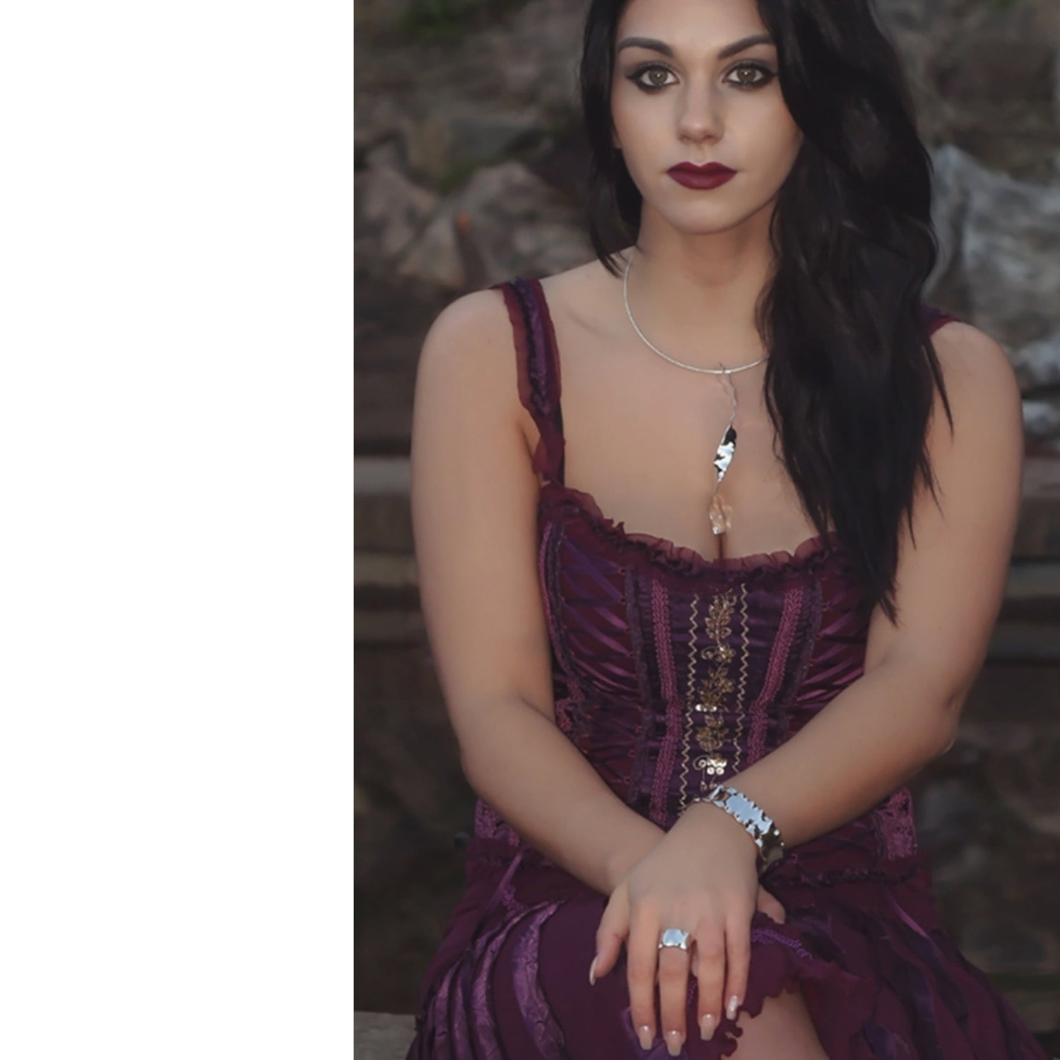 handmade exclusive designer jewellery for women. Dark haired woman wearing silver jewellery collection by Scottish designer Christine Sadler