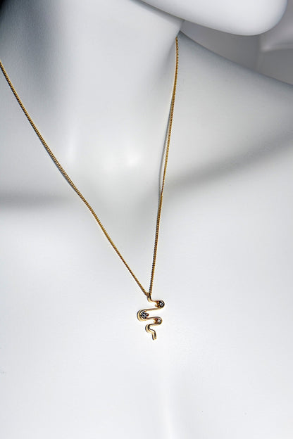 picture of heartbeat diamond trilogy necklace on a model. 