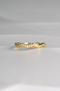 narrow 18ct gold diamond set wavy ring that can be stacked with other rings
