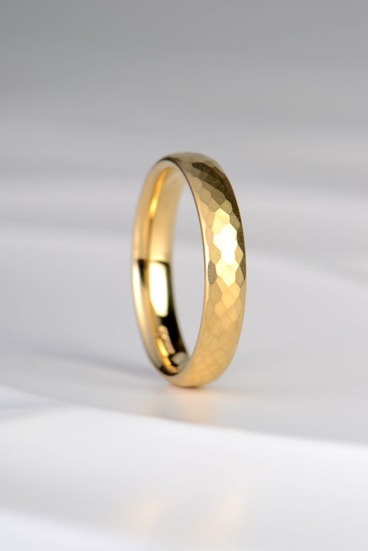 modern 18ct yellow gold wedding ring for a man or for a woman with a textured finish that makes it really special and different