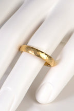modern 18ct yellow gold hammered wedding ring for a man or woman