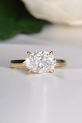 2ct oval lab grown diamond set in an 18ct yellow gold east west ring design with four talon claws.