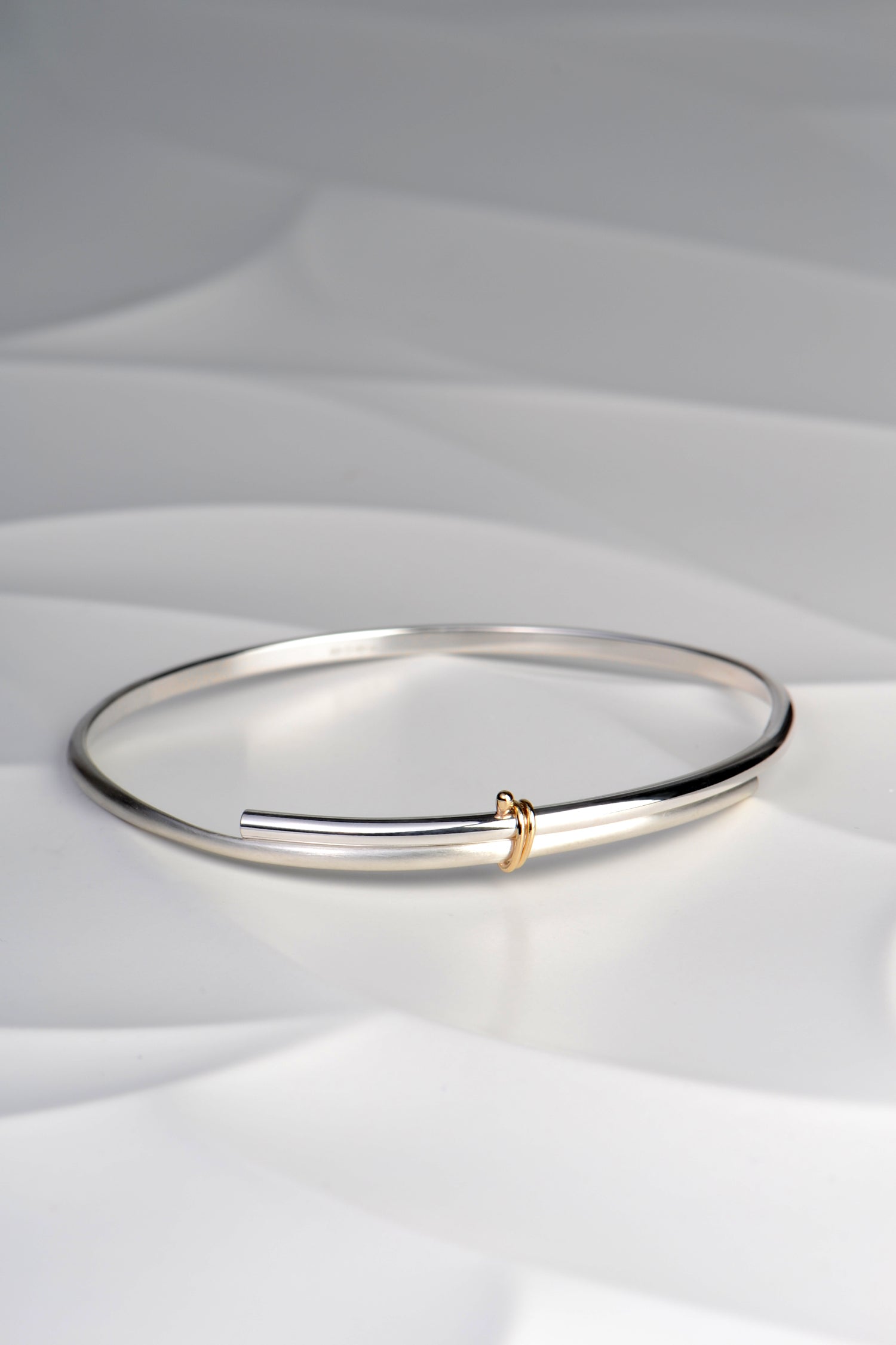 modern silver silver and gold designer handmade bangle from UK jewellery designer Christine Sadler