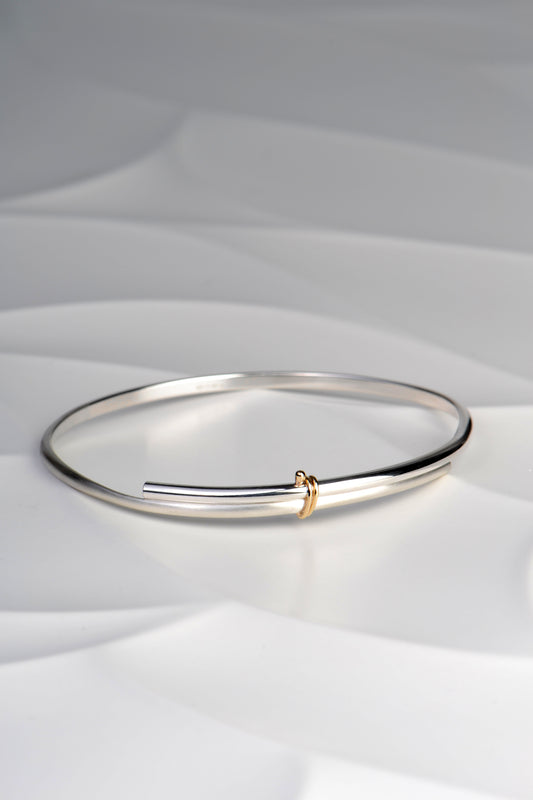 modern silver silver and gold designer handmade bangle from UK jewellery designer Christine Sadler