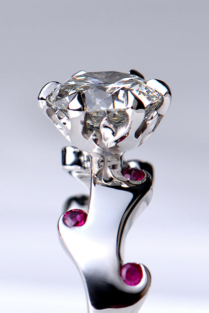 diamond setting that has tiny flames that make the claws by jewellery designer Christine Sadler