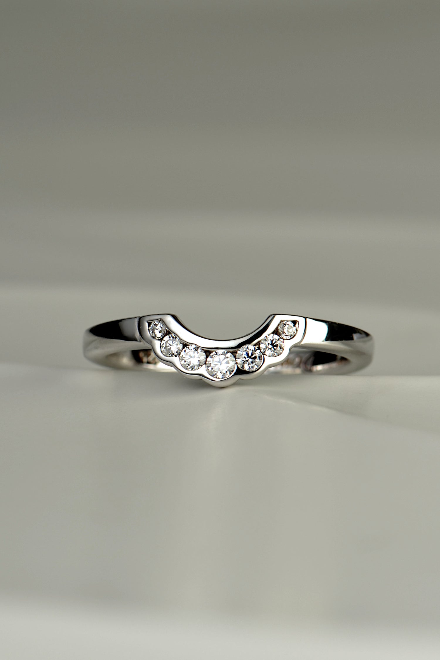 diamond set U shaped wedding ring with modern scalloped edge detail