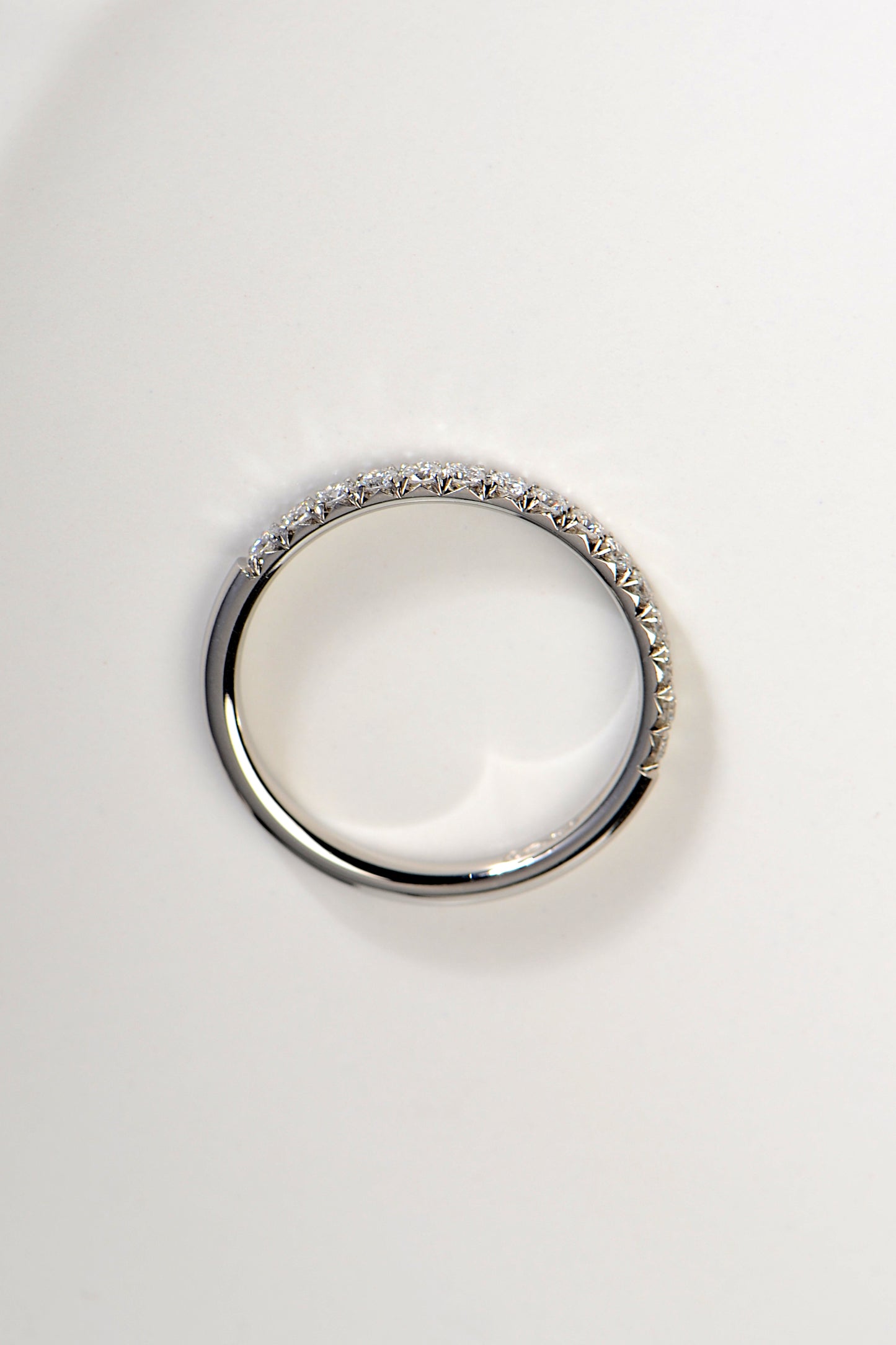 Diamond set eternity or wedding ring with fishtail setting