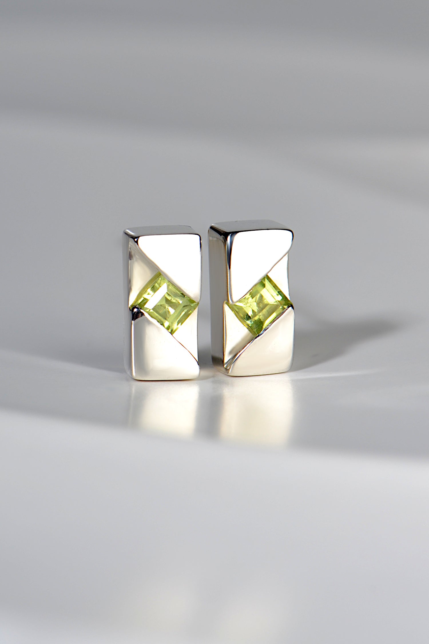 sterling silver earrings handmade and set with a square peridot gemstone