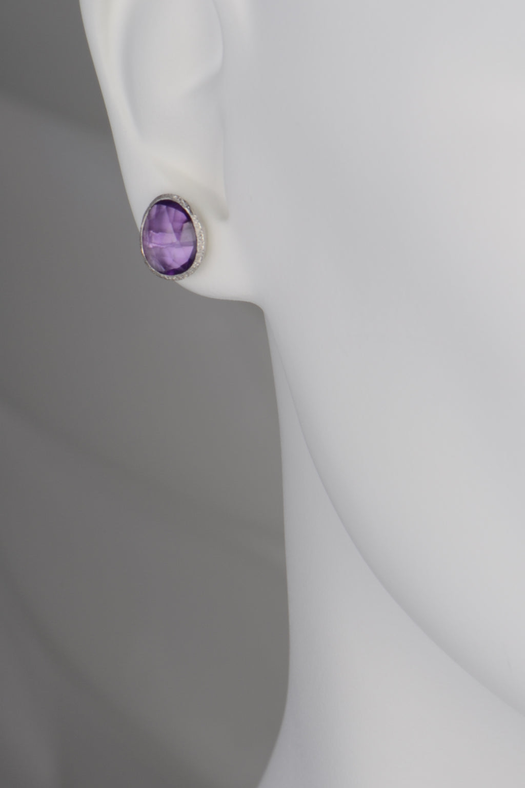 Large faceted amethyst stud earrings set in sterling silver, designed by Jorge Revilla