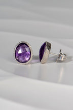Side view showing sterling silver setting of large amethyst birthstone stud earring