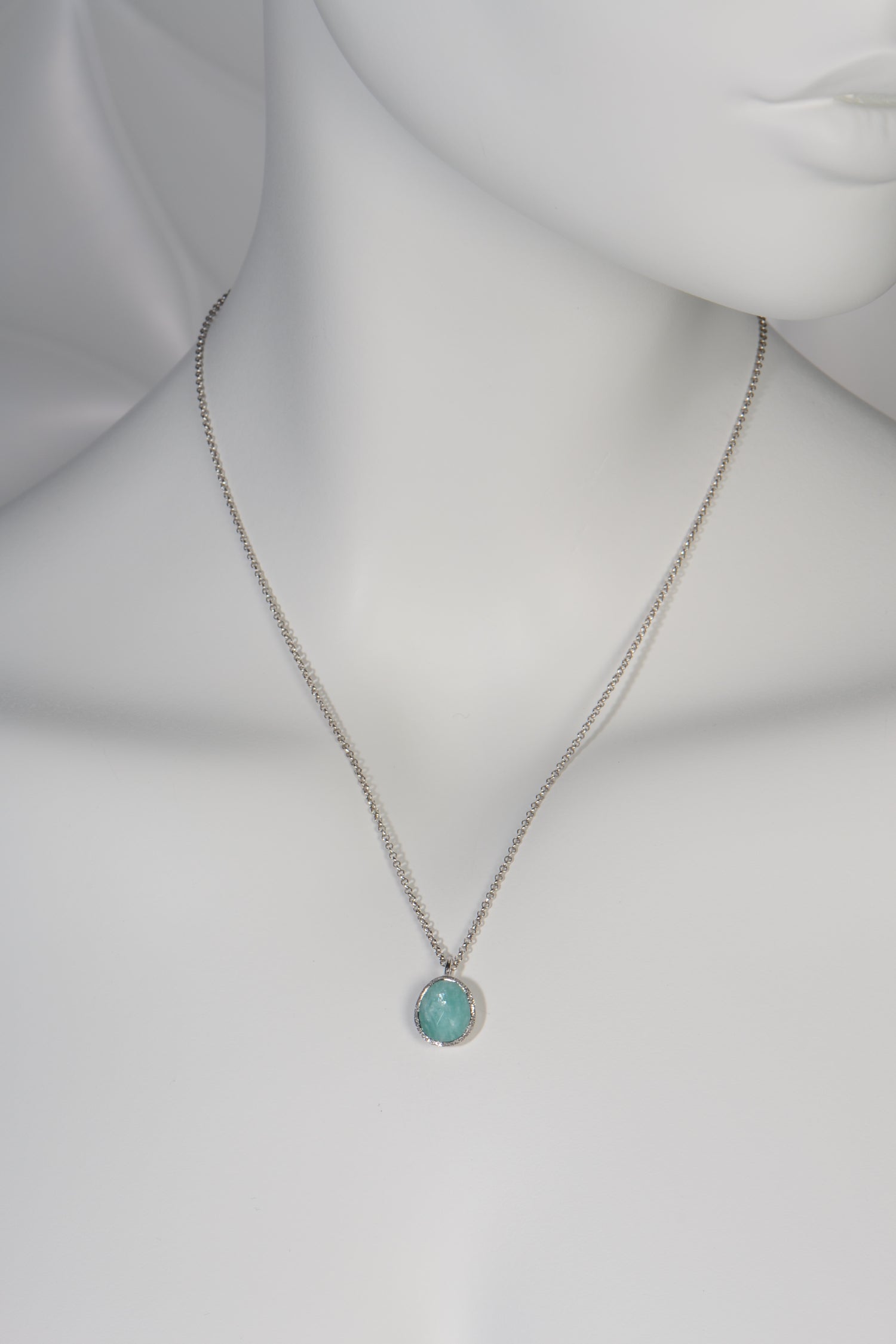 turquoise coloured silver pendant necklace set with the unusual gemstone Aventurine hanging on a fine silver chain by jeweller designer Jorge Revilla