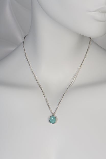 turquoise coloured silver pendant necklace set with the unusual gemstone Aventurine hanging on a fine silver chain by jeweller designer Jorge Revilla