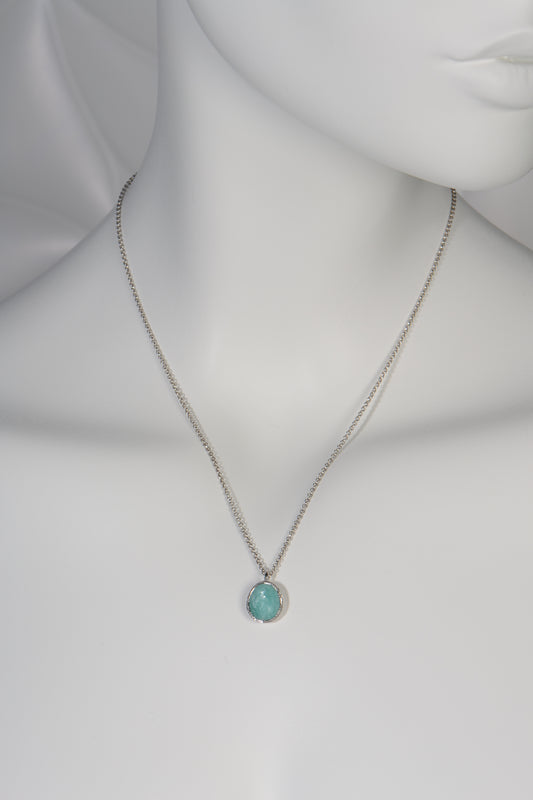 turquoise coloured silver pendant necklace set with the unusual gemstone Aventurine hanging on a fine silver chain by jeweller designer Jorge Revilla