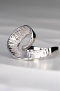 organic sterling silver large ring that is twisted at the front with a seaweed texture by Spanish jewellery designer Jorge Revilla