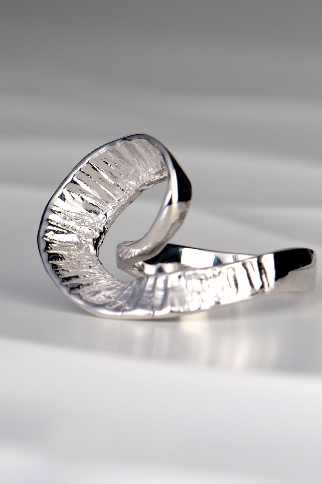 organic sterling silver large ring that is twisted at the front with a seaweed texture by Spanish jewellery designer Jorge Revilla