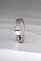 Jorge Revilla brushed silver ring from his forge collection. A modern design that is sculptural and raised to a peak at the front