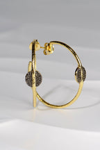 large gold vermeil hoop earrings with black ruthenium detail by jewellery designer Jorge Revilla