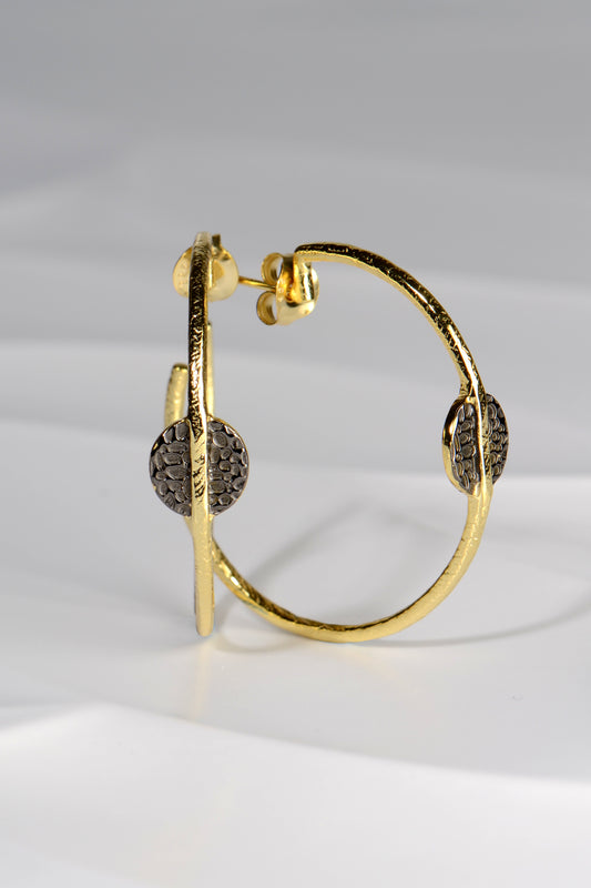 large gold vermeil hoop earrings with black ruthenium detail by jewellery designer Jorge Revilla