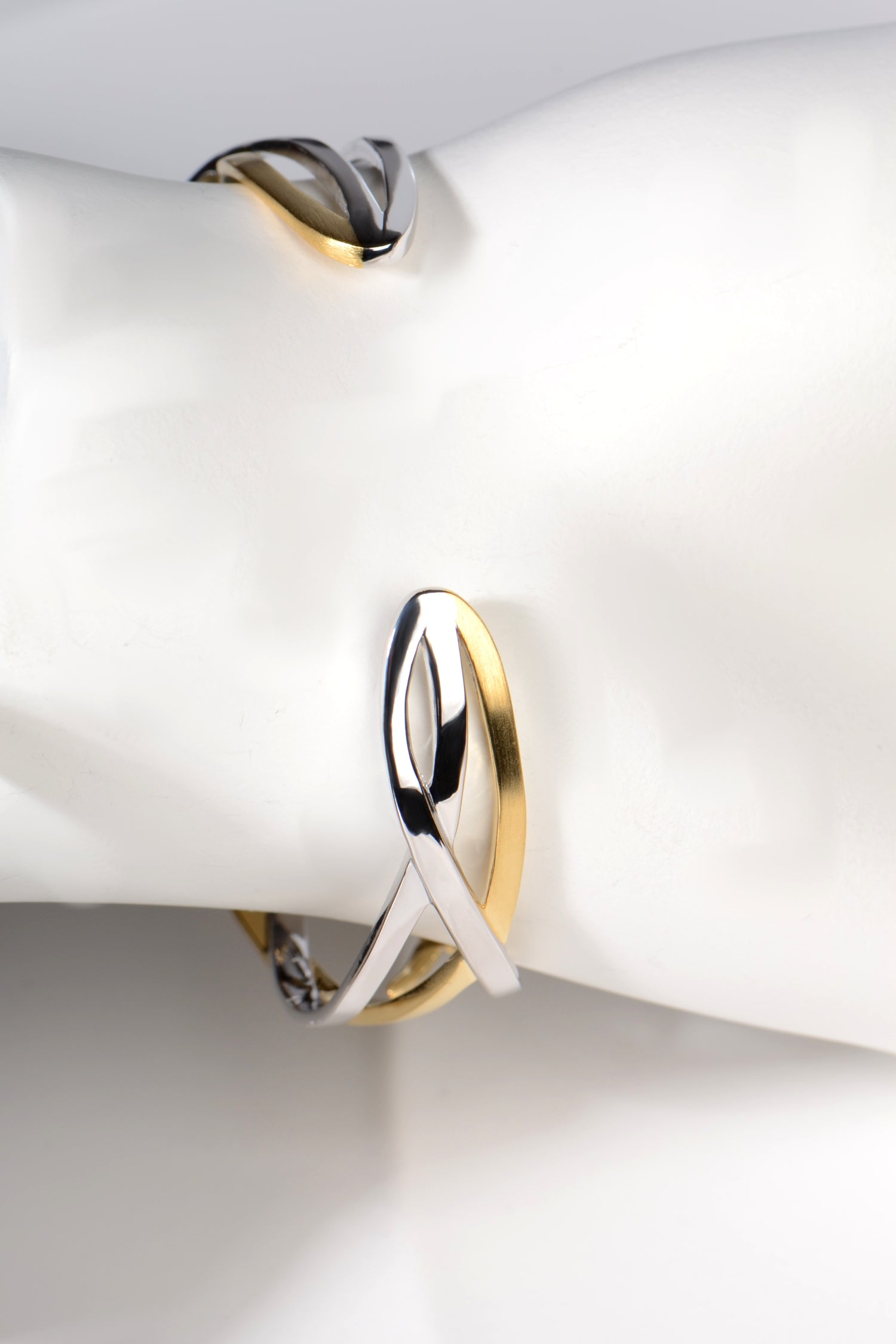 back detail showing a small gap to put the bangle on and off as this Roots bangle is a cuff style