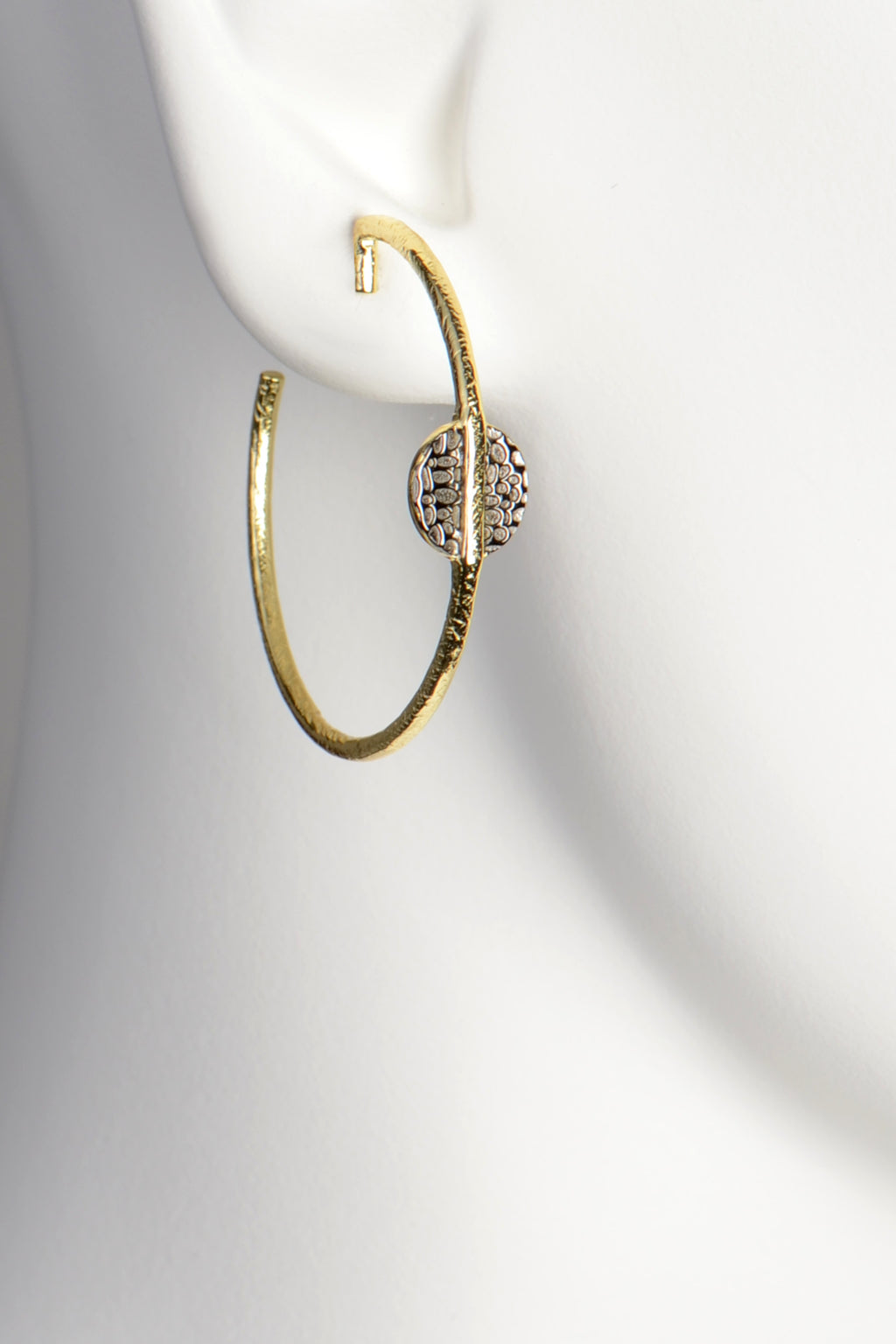contemporary gold vermeil hoop earrings with an stylish texture by jewellery designer Jorge Revilla