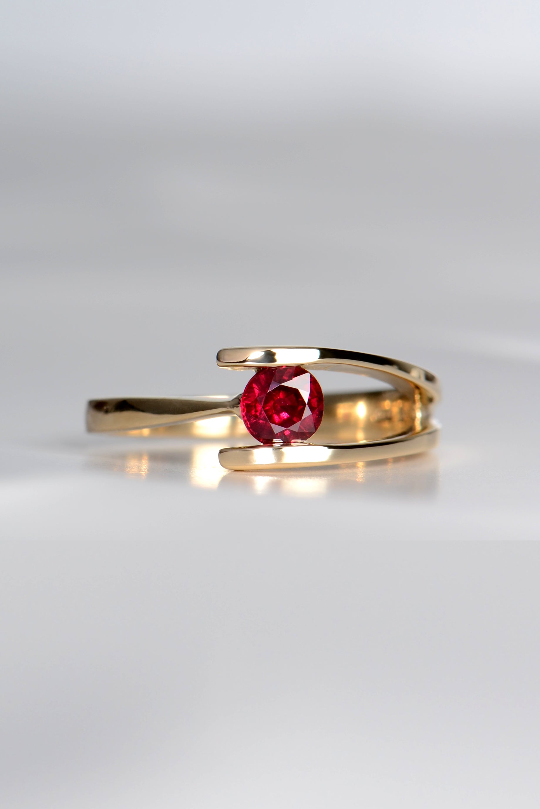 modern ruby ring set in yellow gold