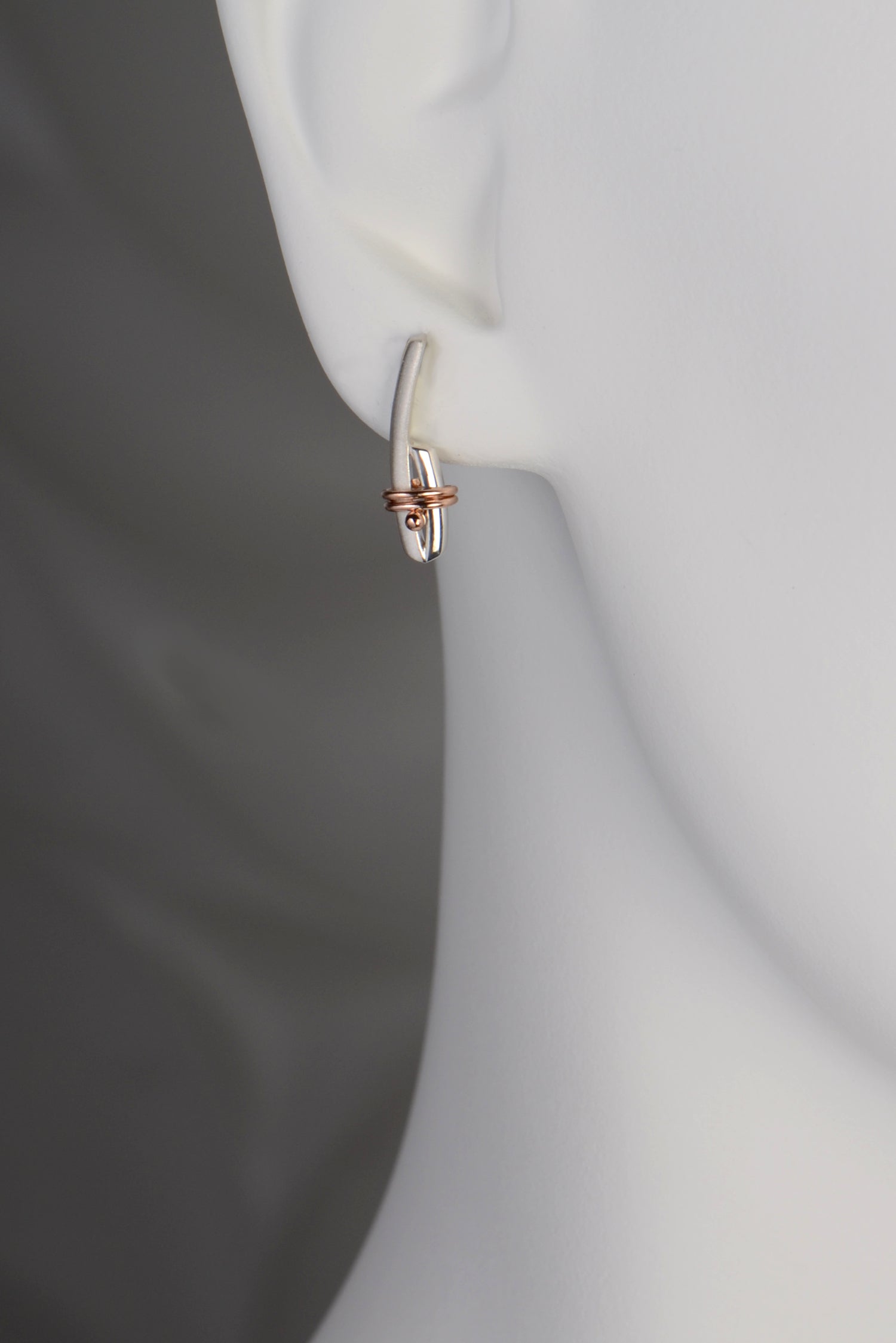 designer silver and rose gold modern earrings that symbolise a bond by jewellery designer Christine Sadler, Ayr