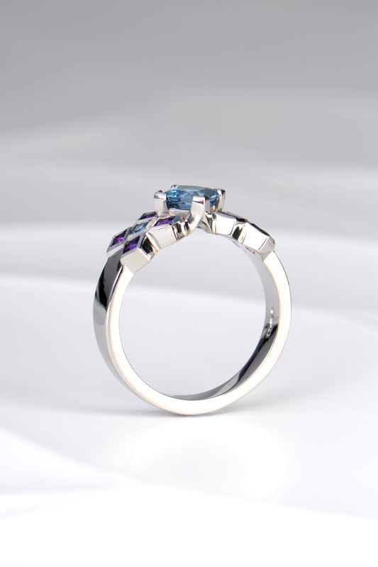 side view of contemporary platinum engagement ring without diamonds made with Aquamarine and amethysts by jewellery designer Christine Sadler