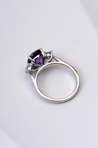 Side view of amethyst and diamond platinum ring showing the snuggle fit design that stacks next to other rings without a space