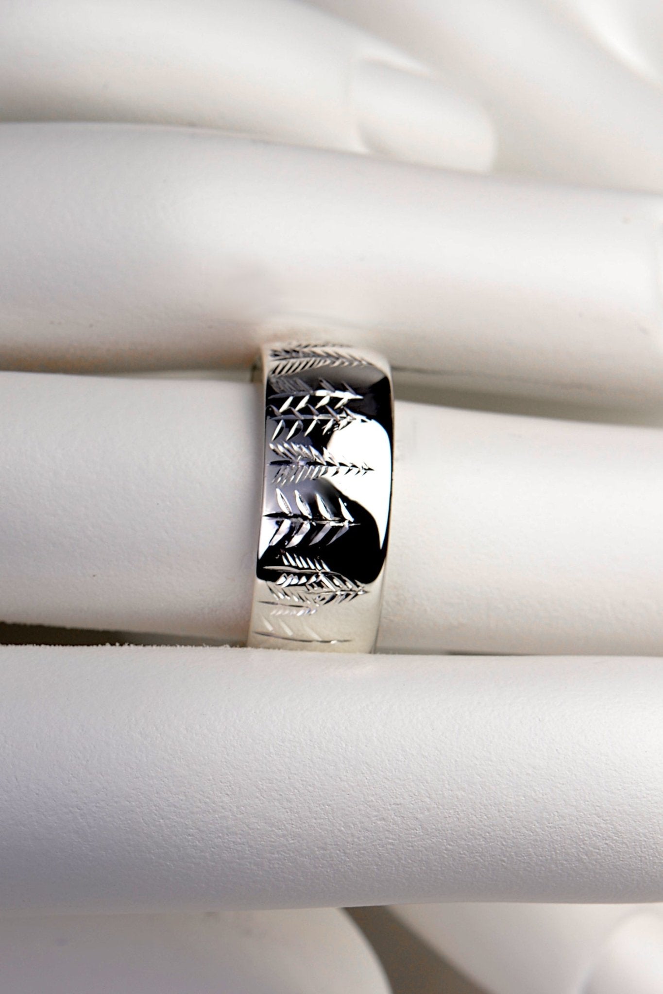 Wide platinum ring with trees engraved by hand. Each ring is unique and hand engraved.