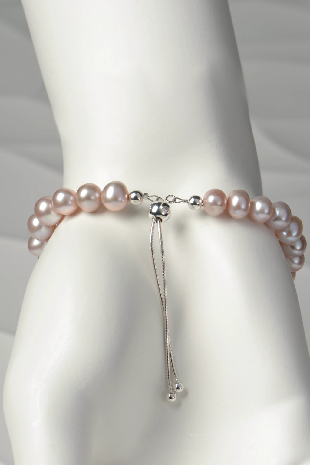 Close up detail of the adjustable silver slider clasp on pale pink cultured pearl bracelet from Christine Sadler