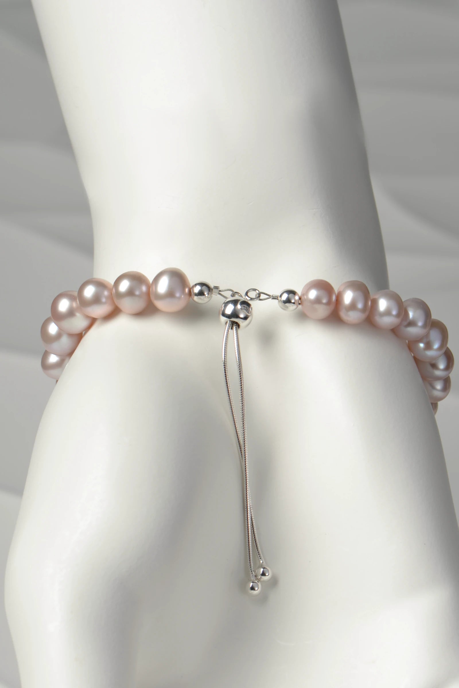 Close up detail of the adjustable silver slider clasp on pale pink cultured pearl bracelet from Christine Sadler