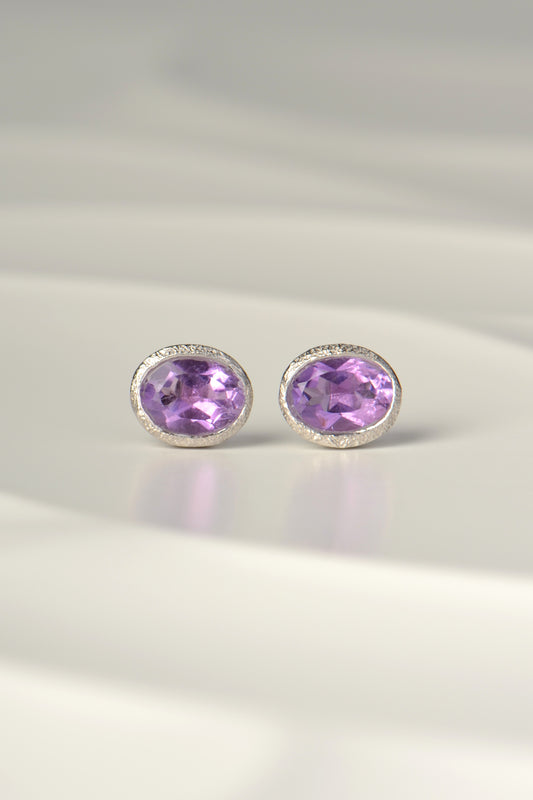 Designer oval amethysts set in handmade silver stud earrings