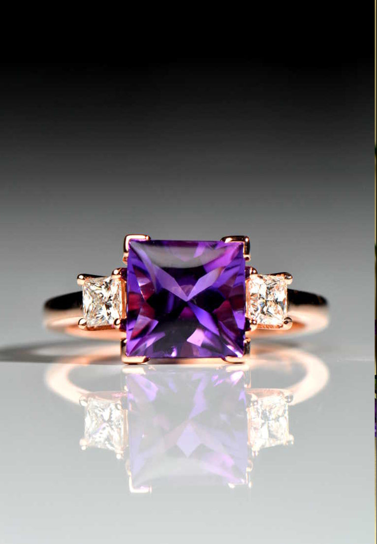 rose gold three stone engagement ring with a large square amethyst in the middle and a princess cut diamond on either side - a bespoke engagement ring commission from Christine Sadler