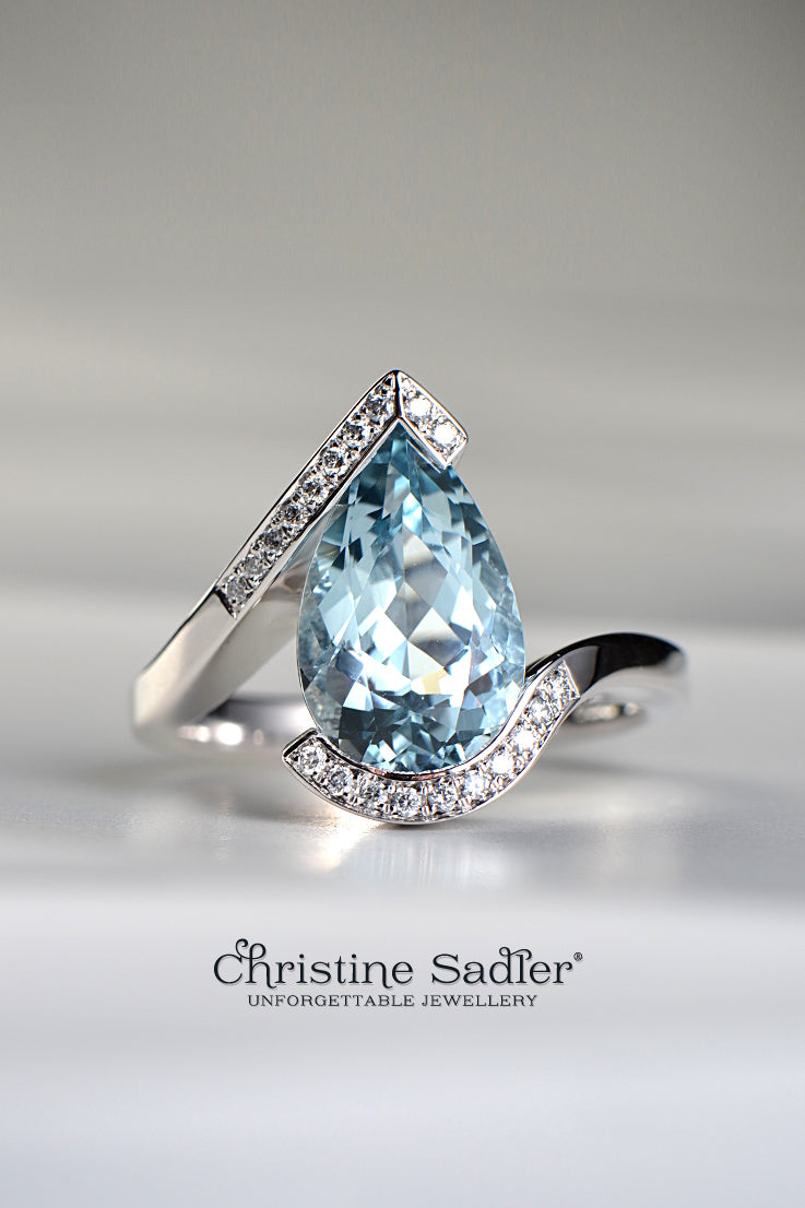 platinum engagement ring with a large pear cut aquamarine and diamonds set in the twist band - Christine Sadler