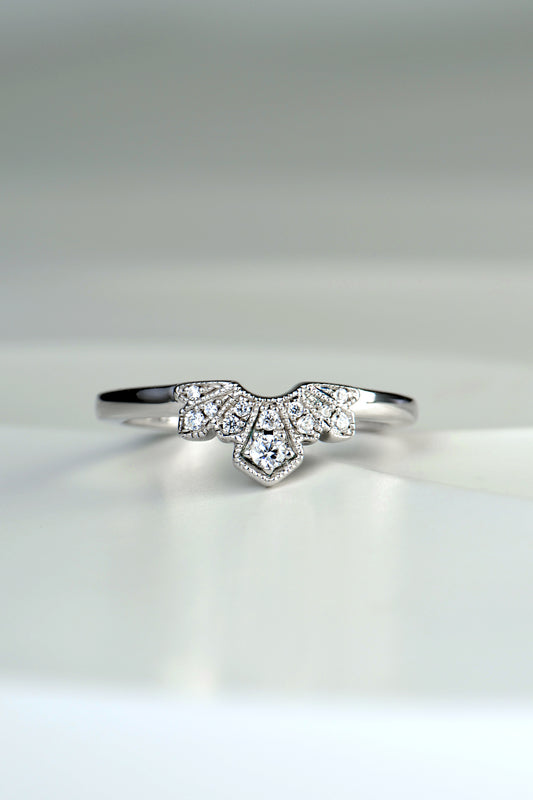 art deco style wedding ring set with diamond if a fan shaped detail at the front